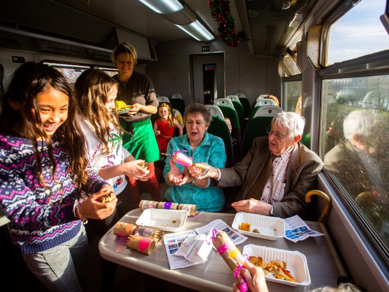 GWR- Year 4 and 5 pupils from the Delaware Primary Academy pull christmas crackers  with local elderly isolated people, whislt travelling on the Tamar Valley Line. The special Christmas event was ran by The Devon and Cornwall Rail Partnership, working with GWR. 17/12/2019