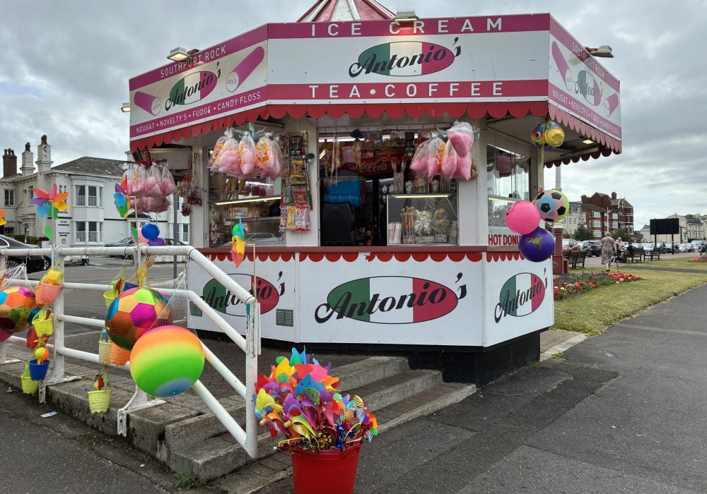 Antonio’s kiosk in classic seaside style, bursting with bright buckets, pinwheels, candy floss and beach balls. One of many vibrant sights captured during our first photo trip along the Liverpool–Southport line.